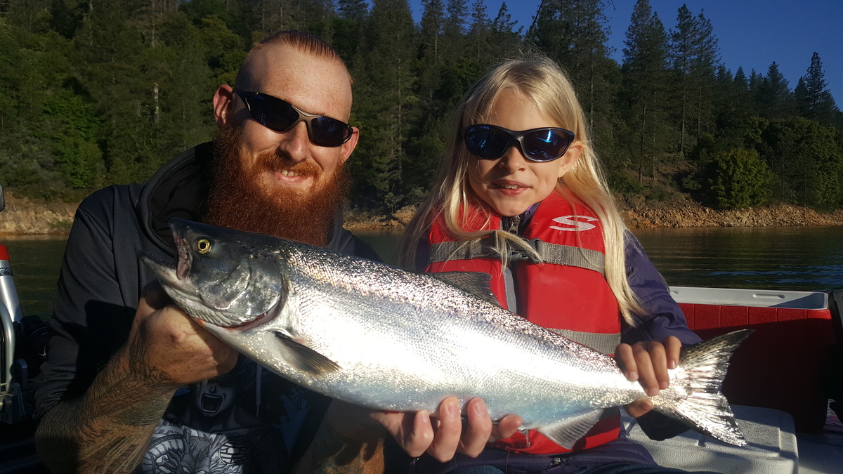Father and daughter with king salmon on Shasta lake 