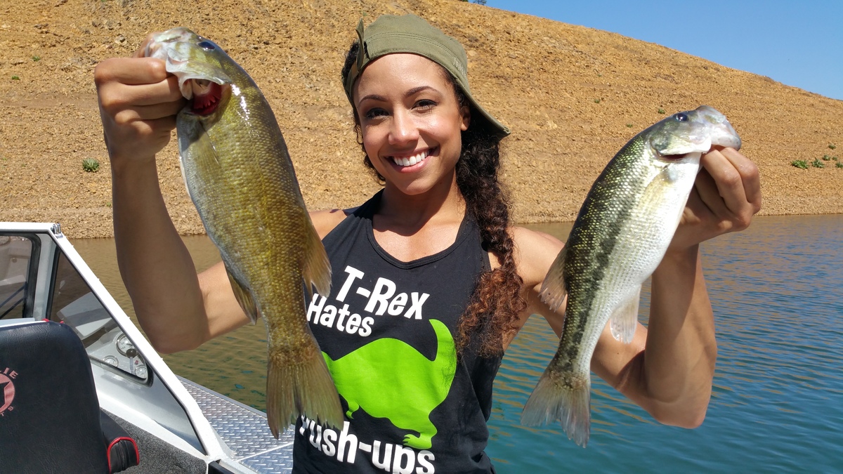 Sandra with a couple of bass from Shasta smallmouth and spotted bass