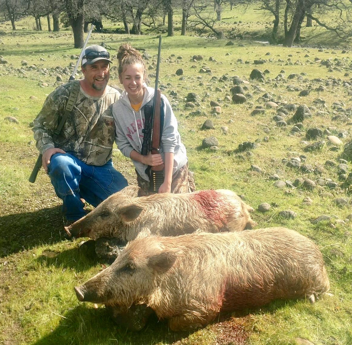 Mike and his daughter with her first pig