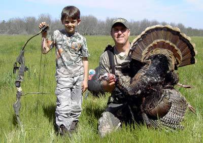 Parker and daddy  Dan with a archery  bird