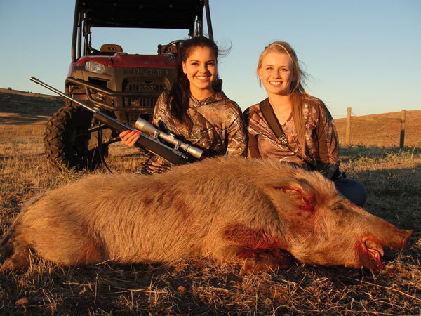Alyssa and Nicole with a blonde boar
